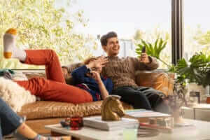 couple on couch watching disney plus