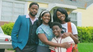 The cast of the wonder years, showing a family of Black actors in 1980s clothing facing the camera