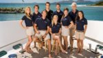 The cast/crew of Below Deck pictured on a boat deck