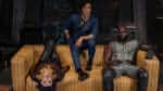 Three main actors of Cowboy Bebop on a couch looking at camera