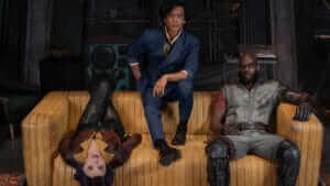Three main actors of Cowboy Bebop on a couch looking at camera