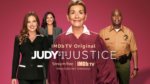 Judge judy and her cast facing the camera