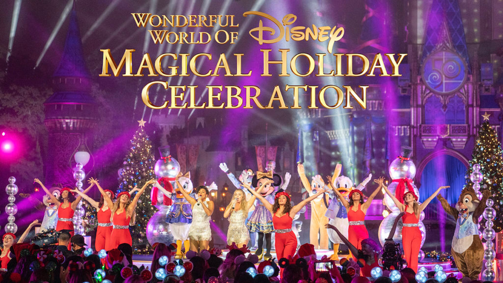 A group of performers and Disney characters on stage in holiday costumes