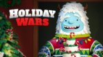 Holiday Wars show logo with icing looking snow monster holding a cake