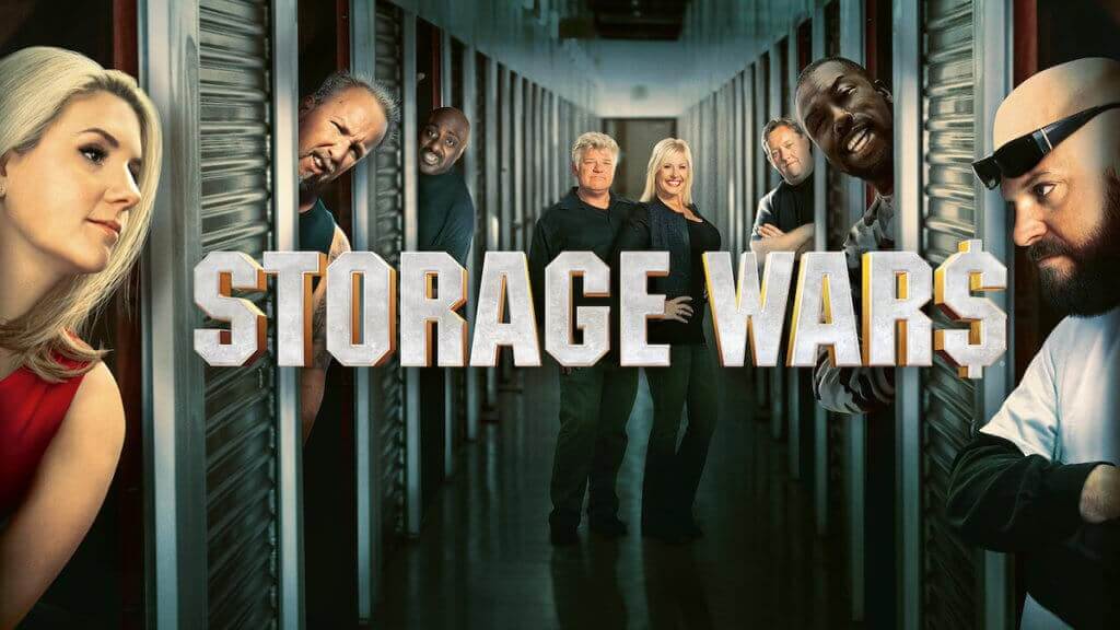 Cast of Storage Wars with logo, looking out from storage units