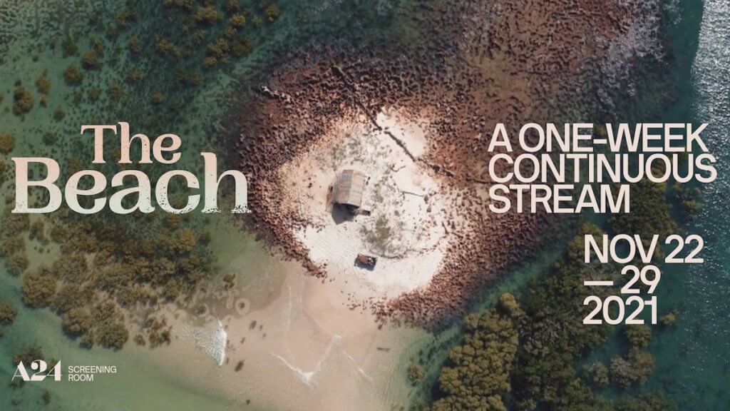 An aerial view of a small shack on a beach