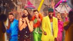 The five queer eye hosts dancing in a mardi gras parade
