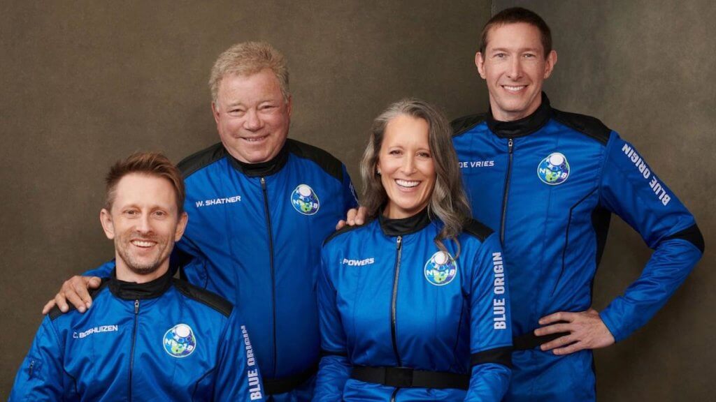 William Shatner and three others pictured in blue space jump suits