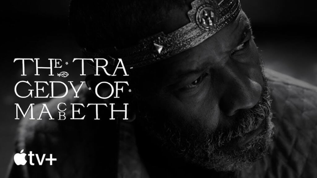 A black and white image of an african american actor in a crown looking off stage