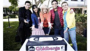 cast of goldbergs showing off their 200th episode