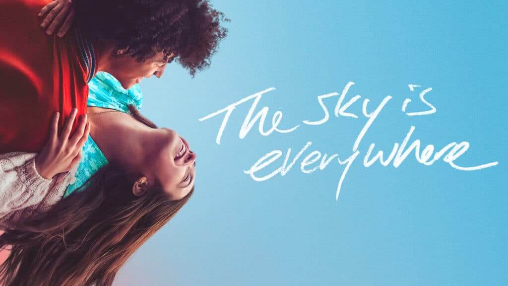 A young couple dances sideways in the sky