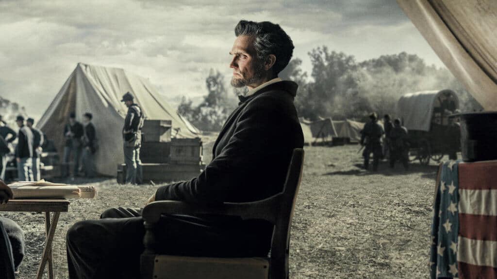 A layered photo of Abraham Lincoln in front of a civil war battle camp