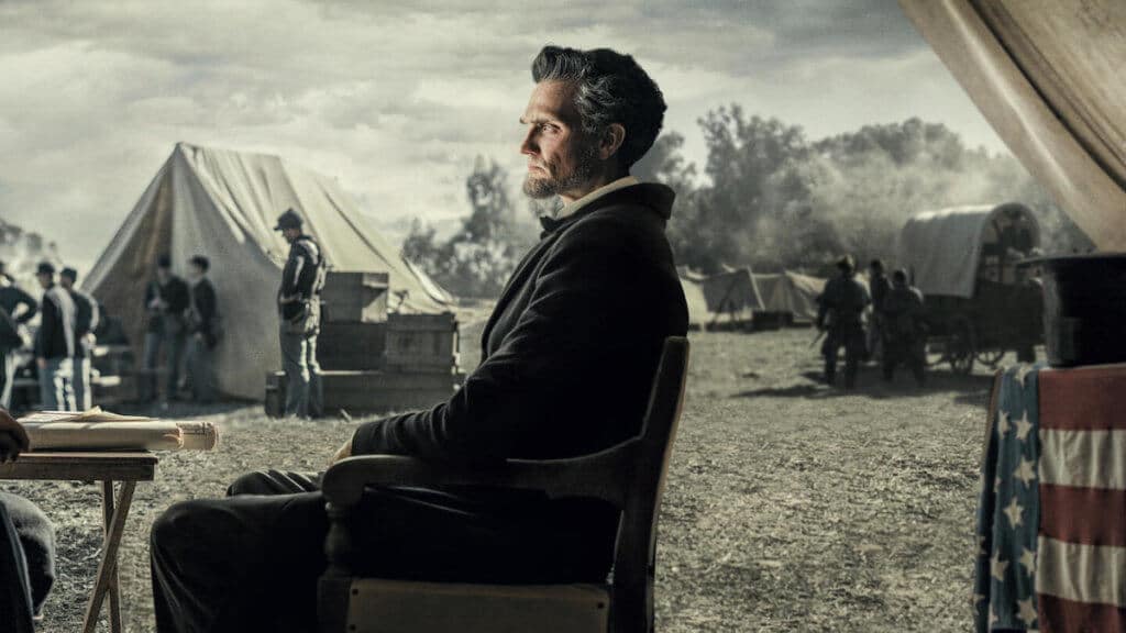 A layered photo of Abraham Lincoln in front of a civil war battle camp 