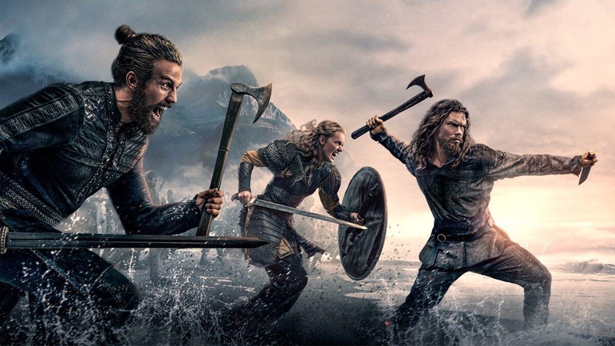 A trio of Vikings storming into the ocean