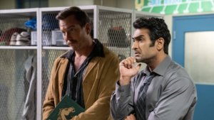 two men standing looking pensive