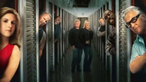 Cast of Storage Wars with logo, looking out from storage units