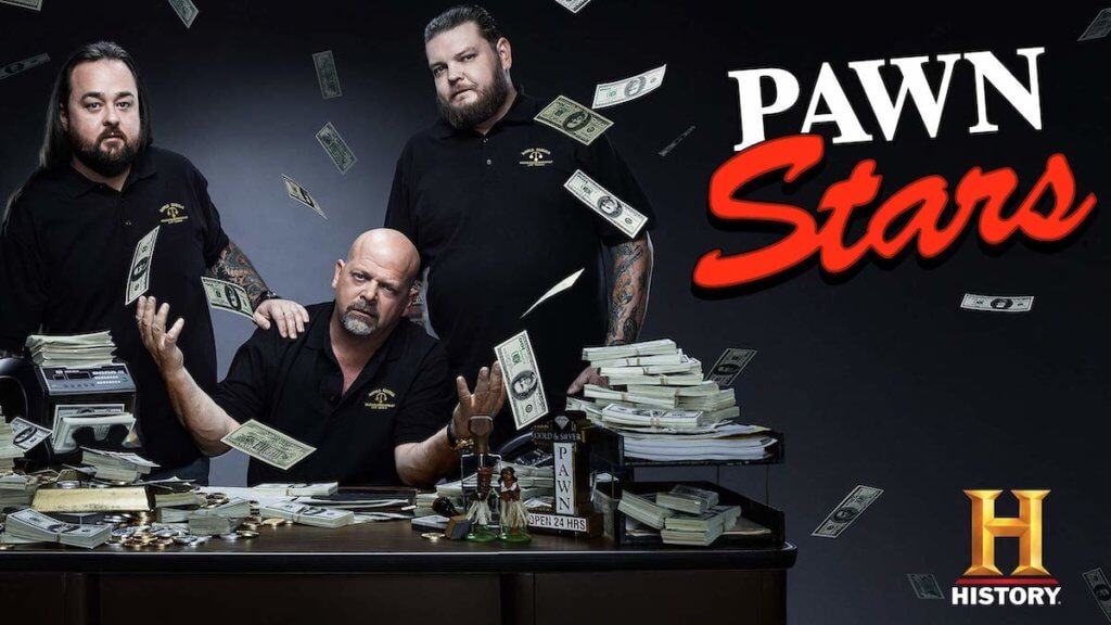 three men surrounded by falling cash