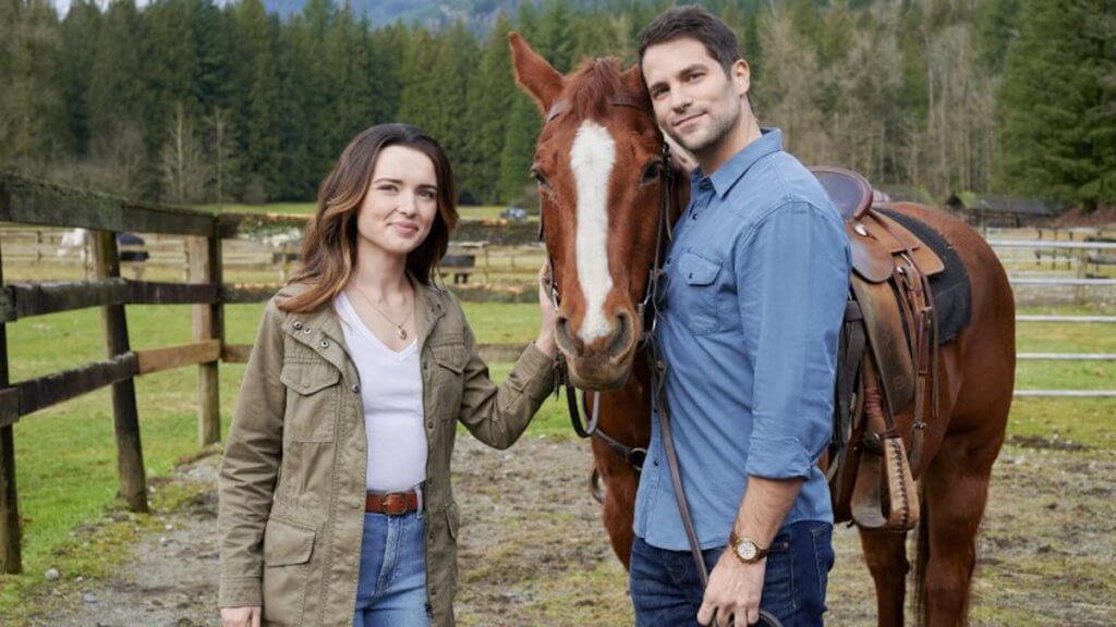 A princess stands by her horse with hot bodyguard