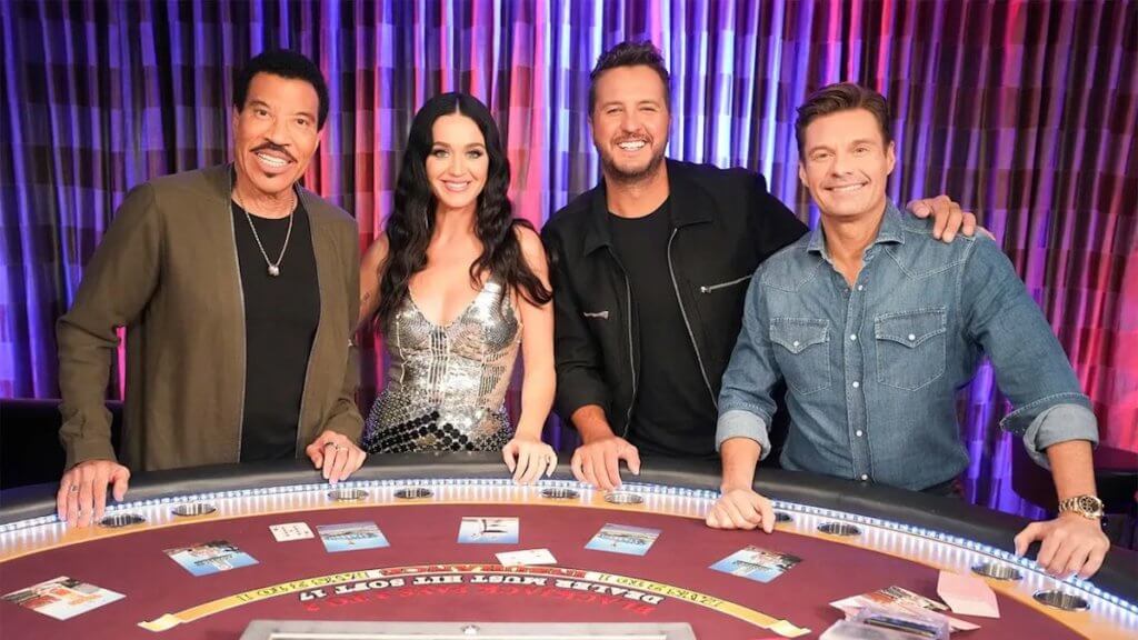 Host and judges of American Idol at a blackjack table