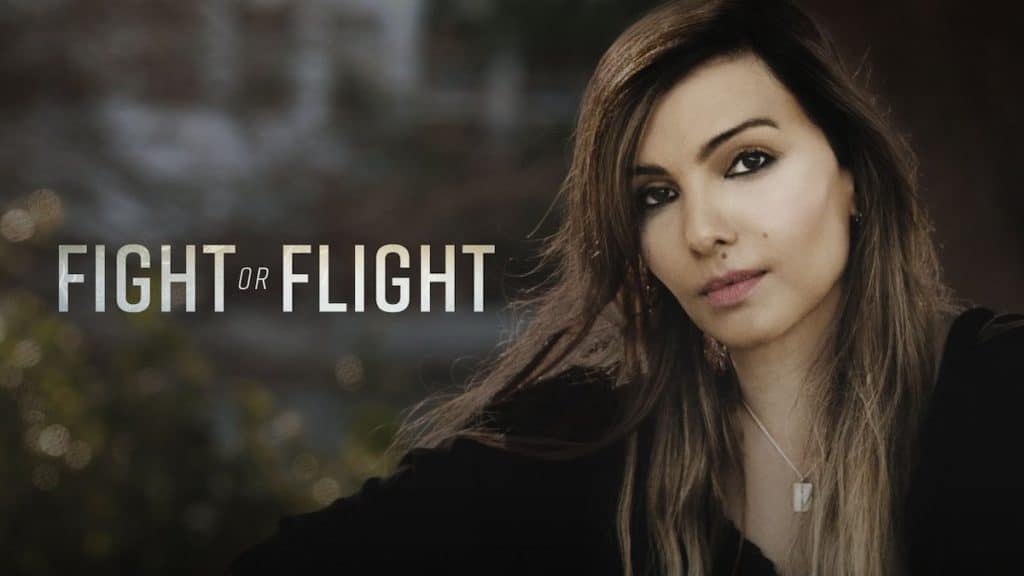 a woman stars at camera next to text fight or flight