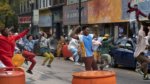 A group of teens dancing in a New York street