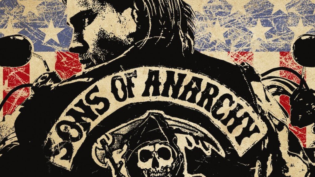 a block print style poster of the back of a biker with American flag print behind him