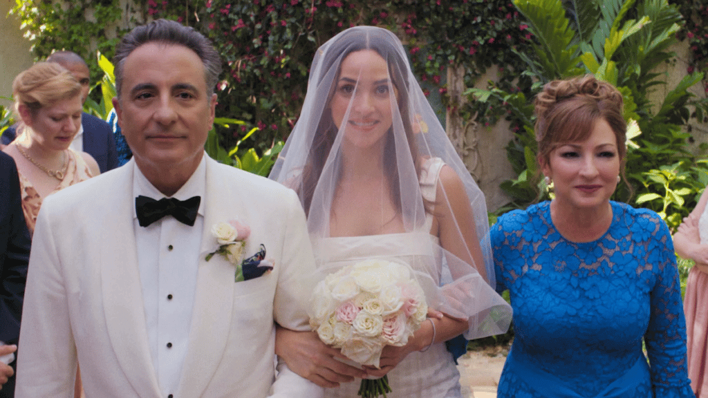 A couple walking a bride down an aisle