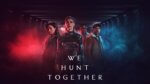 A killer, her apprentice and two cops stand in a shadowy corridor