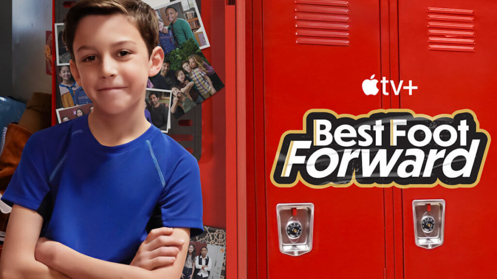 A young boy leaning against a red school locker