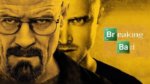 Two men stare down the camera next to logo for Breaking Bad