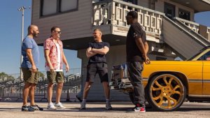 three hosts of top gear talking to a guest about Florida sports