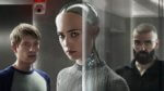 A robotic woman flanked by two men