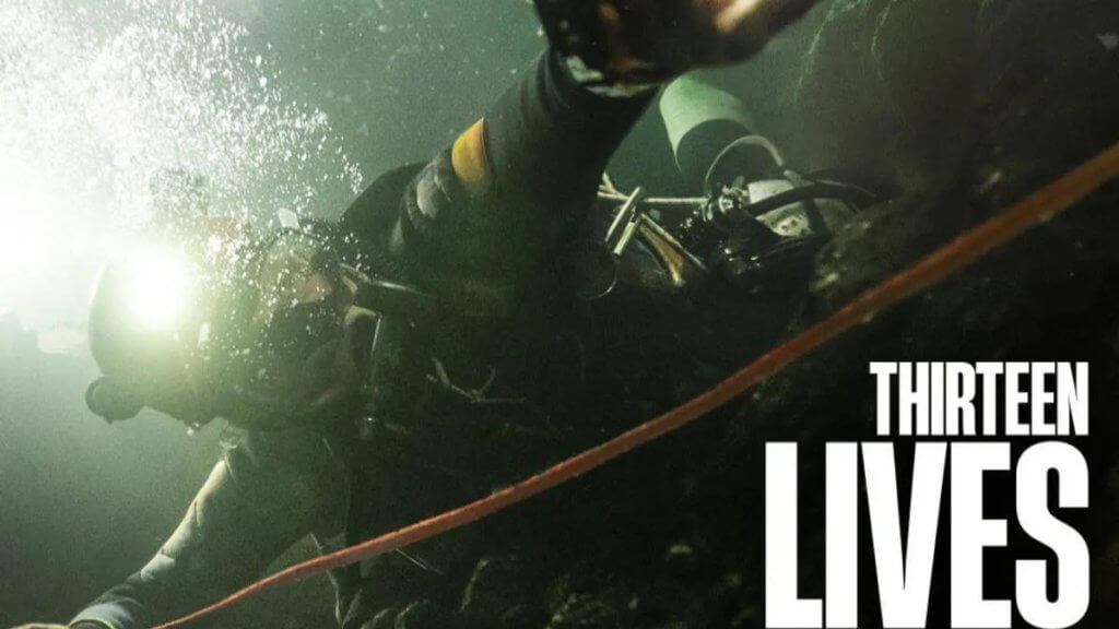 An underwater diver reaching through the water