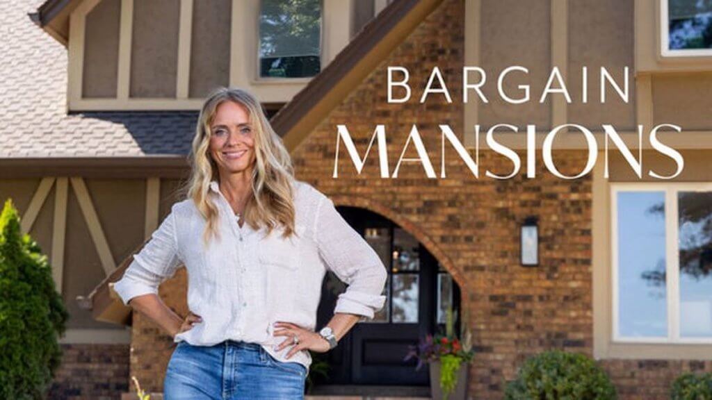 A blonde designer in front of a large old home