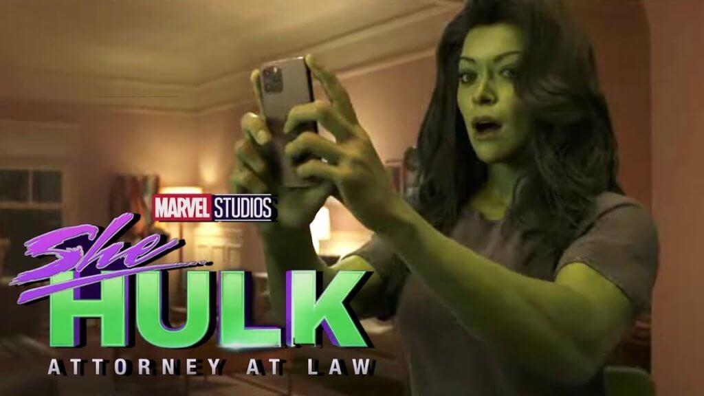 a muscular green woman taking a selfie