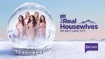 A group of five women in pink dresses in a snow globe