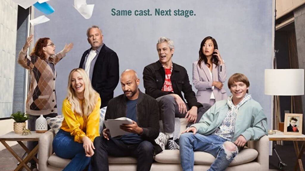 A group of actors and writers on a couch in a sitcom promo shot