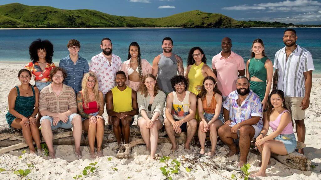 A group of Survivor season 44 contestants gathered on a tropical beach