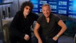Howard Stern and Bruce Springsteen sitting on a radio studio couch