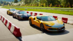 three fancy sports cars poised to start on autobahn