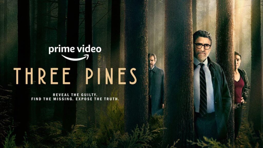 Three detectives stand partially obscured behind trees in a forest
