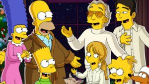 The Simpson and Bocelli families by a Christmas tree