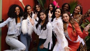 A group of beauty pageant contestants posing in casual wear