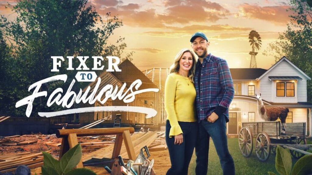 A couple stands in front of a pile of rough construction on one side and an updated farmhouse on the other