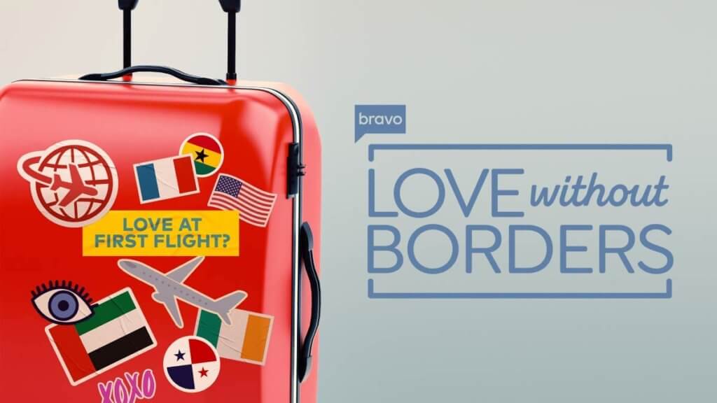 show logo next to a red suitcase covered with travel stickers