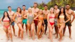 A group of sexy singles in bathing suits on a tropical beach