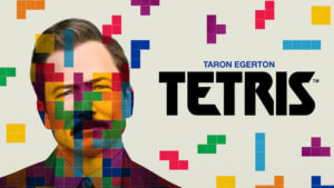 A man's face obscured by falling Tetris blocks
