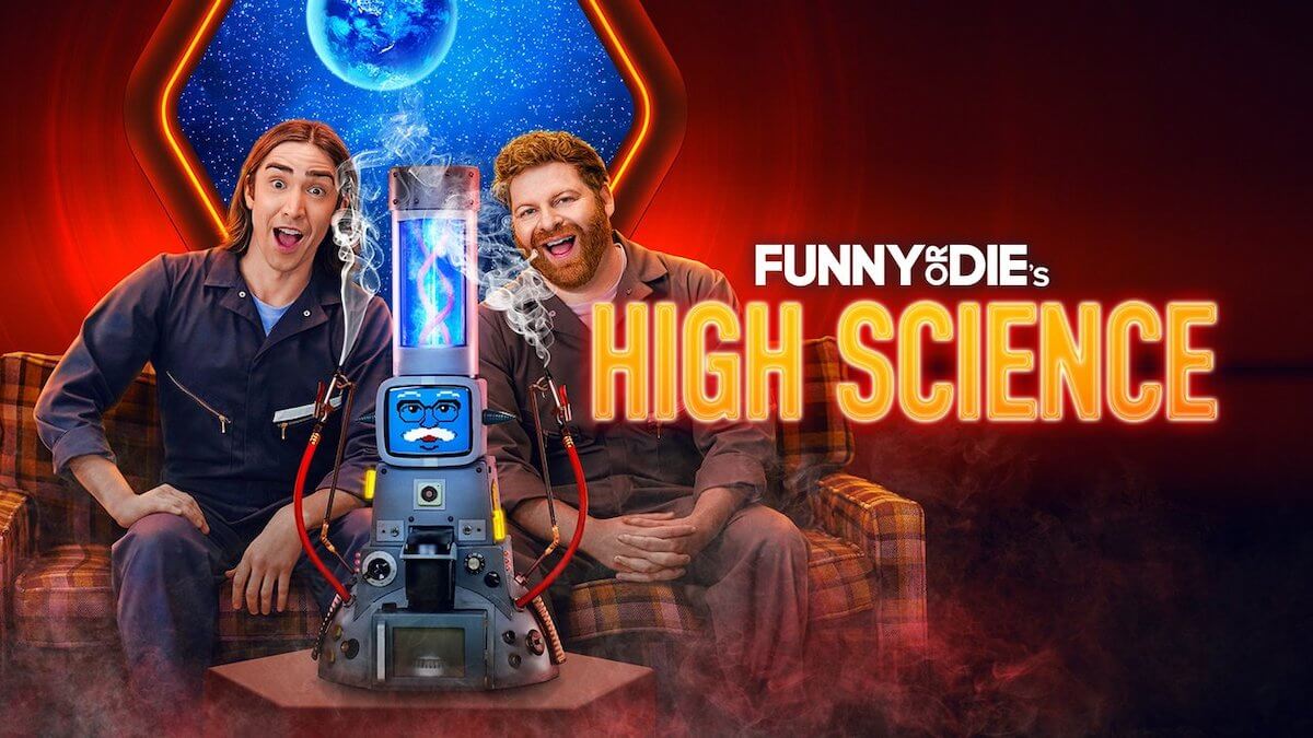 Two guys sit on a plaid couch with a window to space behind them and a futuristic bong with a face in front of them.