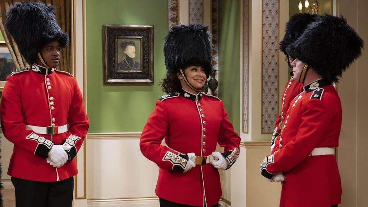 Stars of Raven's Home wearing beefeater uniforms and hats