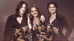 Three women in suits over an image of a women's soccer team celebrating